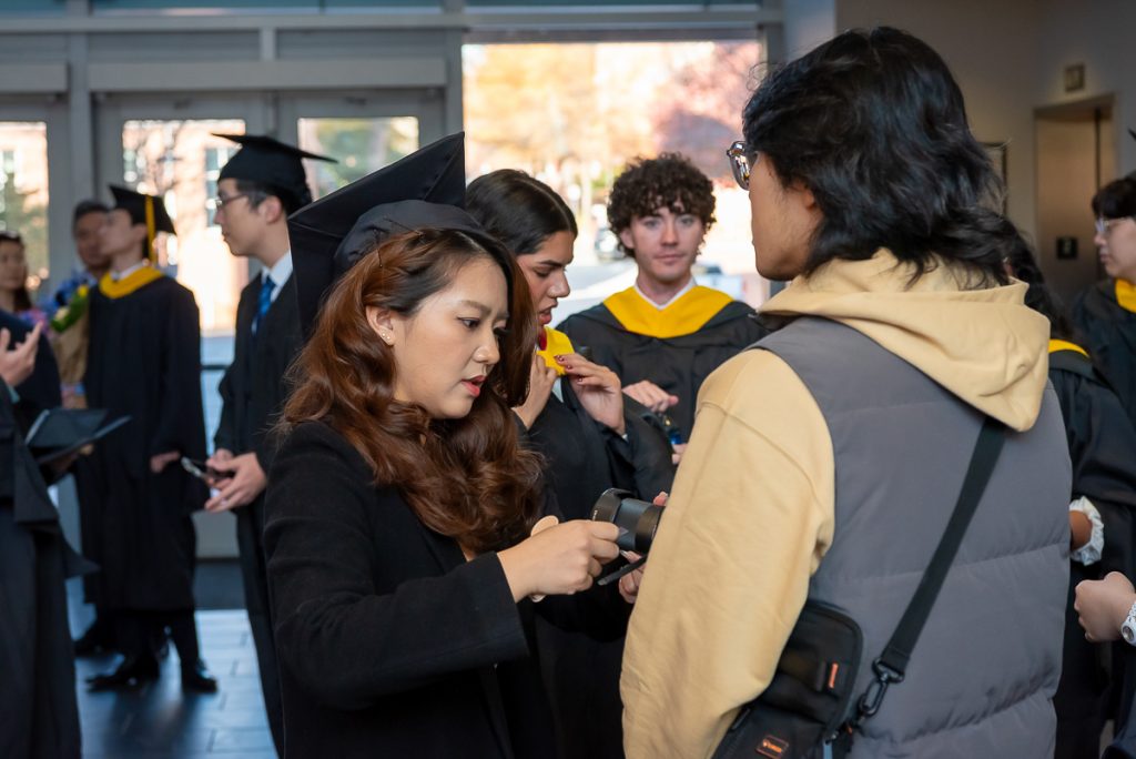 FinMath students gathering in lobby post commencement