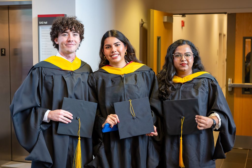 FinMath students posing for photos post commencement