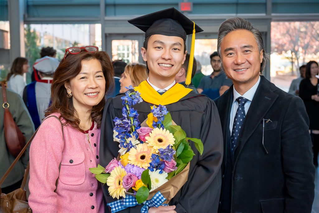 FinMath student and his family posing for photos post commencement