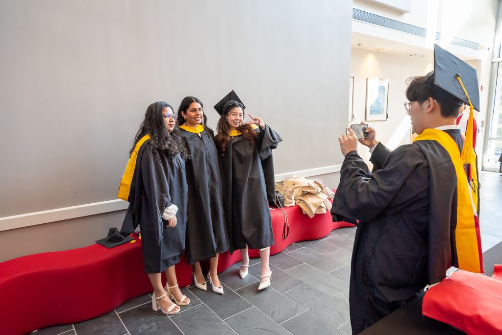 FinMath graduates posing for photos post commencement