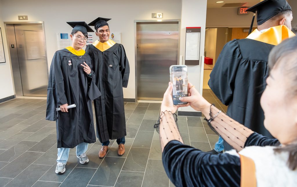 FinMath students posing for photos post commencement